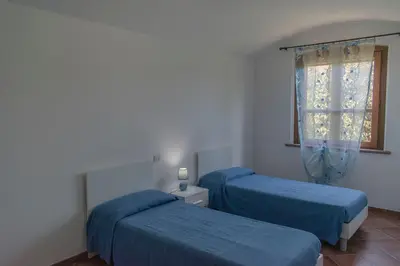 Letto o letti in una camera di Casa vacanze Tortoli'