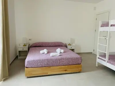 Letto o letti in una camera di B&B S'arciaredda