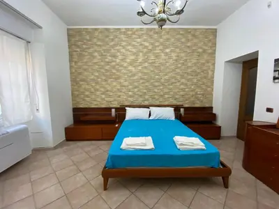 Letto o letti in una camera di Rossini's house
