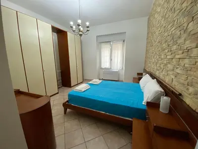 Letto o letti in una camera di Rossini's house