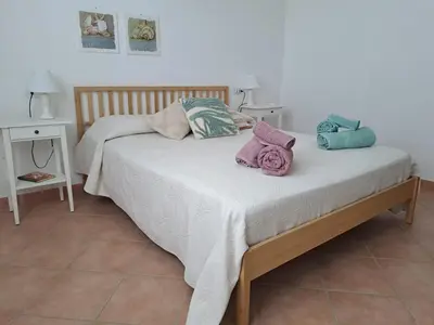Letto o letti in una camera di Venus Apartment Villasimius