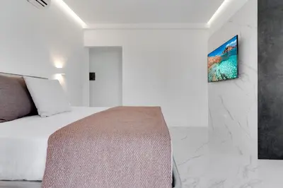 TV o dispositivi per l'intrattenimento presso Caralis Suites Rooms