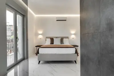Letto o letti in una camera di Caralis Suites Rooms