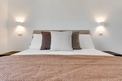 Letto o letti in una camera di Caralis Suites Rooms