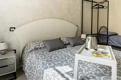 Letto o letti in una camera di Flower Rooms Cagliari