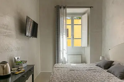 Letto o letti in una camera di Flower Rooms Cagliari