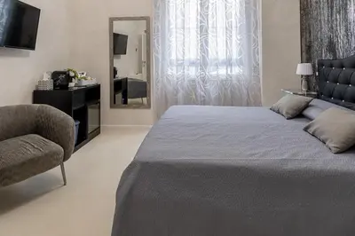Letto o letti in una camera di Flower Rooms Cagliari