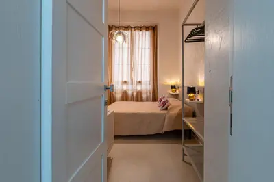 Letto o letti in una camera di Flower Rooms Cagliari