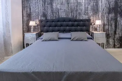 Letto o letti in una camera di Flower Rooms Cagliari