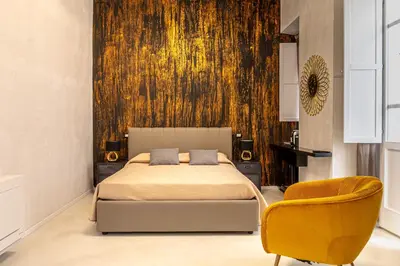 Letto o letti in una camera di Flower Rooms Cagliari