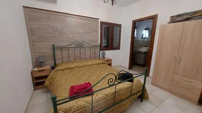 Letto o letti in una camera di Sa domu 'e pisittu