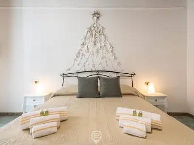 Letto o letti in una camera di La Dama dei Fiori Apartment