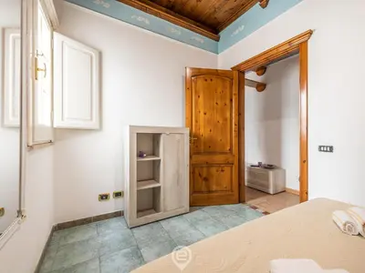 Letto o letti in una camera di La Dama dei Fiori Apartment