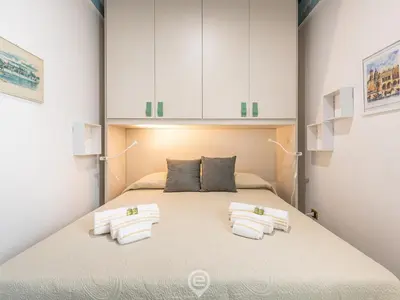 Letto o letti in una camera di La Dama dei Fiori Apartment
