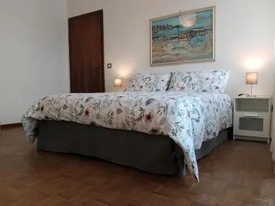 Letto o letti in una camera di Appartamento panoramico Cagliari, I TRE GRILLI, centro