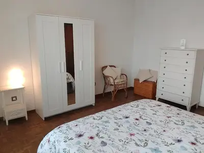 Letto o letti in una camera di Appartamento panoramico Cagliari, I TRE GRILLI, centro