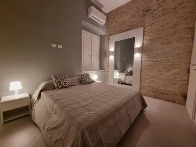Letto o letti in una camera di Luxury Apple Room Apartment Cagliari