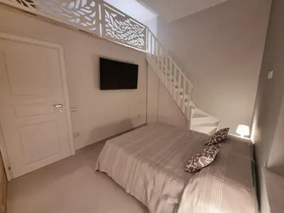 Letto o letti in una camera di Luxury Apple Room Apartment Cagliari