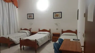 Letto o letti in una camera di Hotel 4 Mori