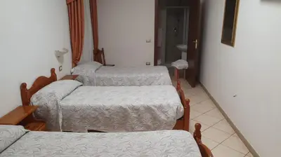 Letto o letti in una camera di Hotel 4 Mori