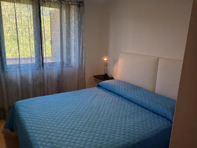 Letto o letti in una camera di Grazioso e confortevole attico, costa sud-ovest