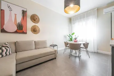 Area soggiorno di Corner Apartment via Italia