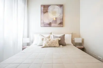 Letto o letti in una camera di Corner Apartment via Italia