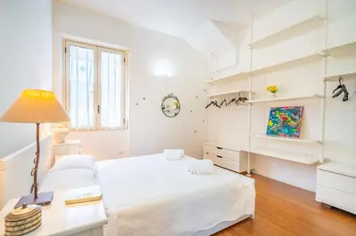Letto o letti in una camera di Attico Luce e Colori - Terrazza Vista Mare - 5 Bdr