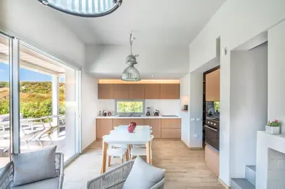 Cucina o angolo cottura di Villa Kòsmos - Piscina e Giardino - Villasimius