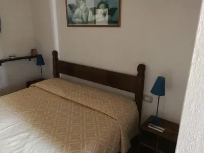 Letto o letti in una camera di Villa Centauro
