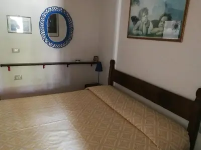 Letto o letti in una camera di Villa Centauro