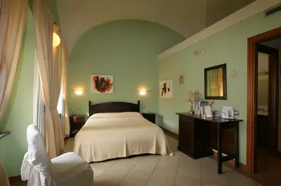 Letto o letti in una camera di Hotel Il Duomo PHG