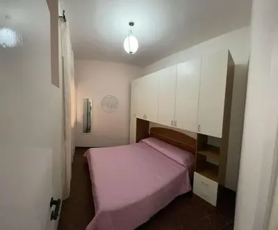 Letto o letti in una camera di Casa Alice