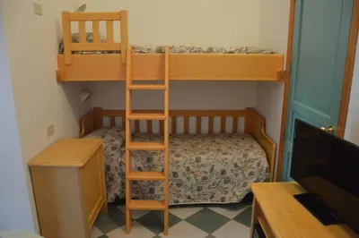 Letto o letti a castello in una camera di Guardia dei Mori