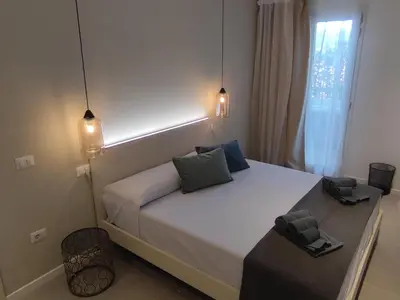 Letto o letti in una camera di Live Home Rooms