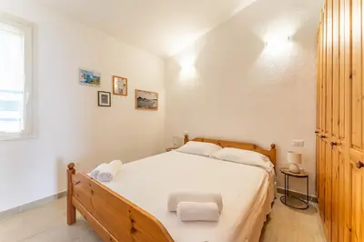 Letto o letti in una camera di Casa Smeralda, Sea View beachfront SouthSardiniaHolidays