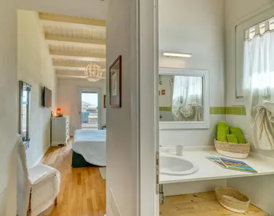 Letto o letti in una camera di La Casa degli Ulivi appartamento in villa con patio