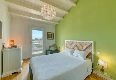 Letto o letti in una camera di La Casa degli Ulivi appartamento in villa con patio