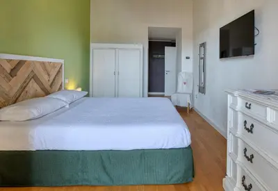 Letto o letti in una camera di La Casa degli Ulivi appartamento in villa con patio