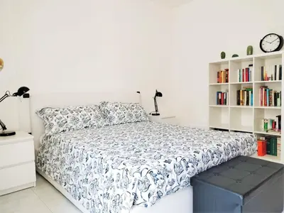 Letto o letti in una camera di Bougainvillea Home - Ospedale Policlinico Monserrato