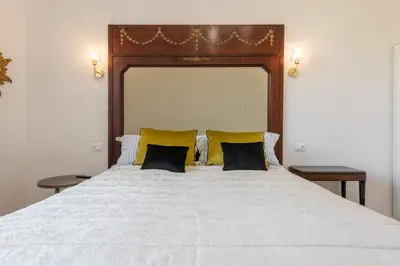 Letto o letti in una camera di Suite Speciosa Bestvacationever