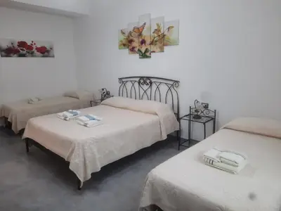 Letto o letti in una camera di CENTRAL ROOMS TORTOLI'