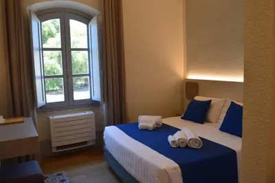 Letto o letti in una camera di TANIT ROOMS & SPA