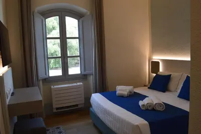 Letto o letti in una camera di TANIT ROOMS & SPA