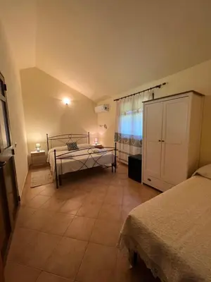 Letto o letti in una camera di Agriturismo Su Barraccu