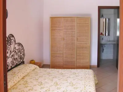 Letto o letti in una camera di Apartment in Costa Rei with Stunning Sea View