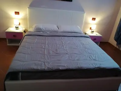 Letto o letti in una camera di LA Tavola Ristorante Pizzeria Da Rino & Figli