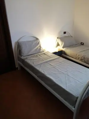 Letto o letti in una camera di LA Tavola Ristorante Pizzeria Da Rino & Figli