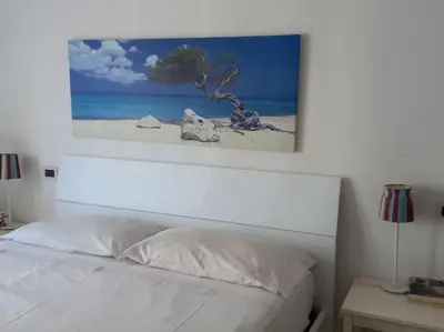 Letto o letti in una camera di Residenza L’Elicriso - Assemini