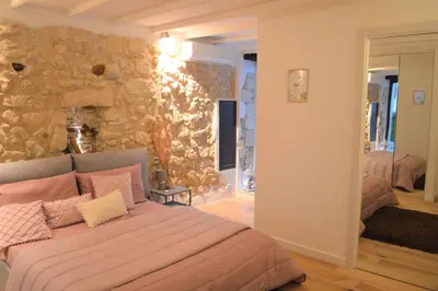 Letto o letti in una camera di Domu 600 - Suite mini appartamento Cagliari centro storico